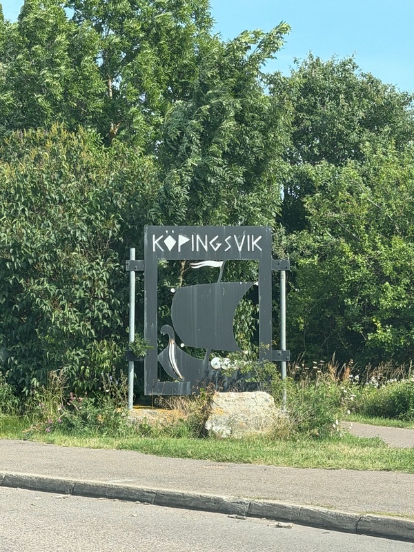Entrance sign to Köpingsvik, which includes the silhouette of a Viking ship