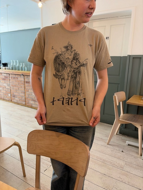 T-shirt with rune-looking material.