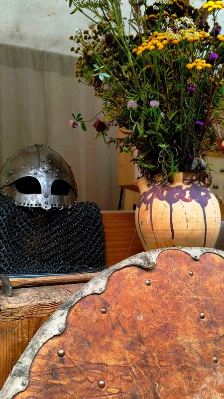 Shield, helmet and vase reproductions at Viking Valley (Gudvangen)