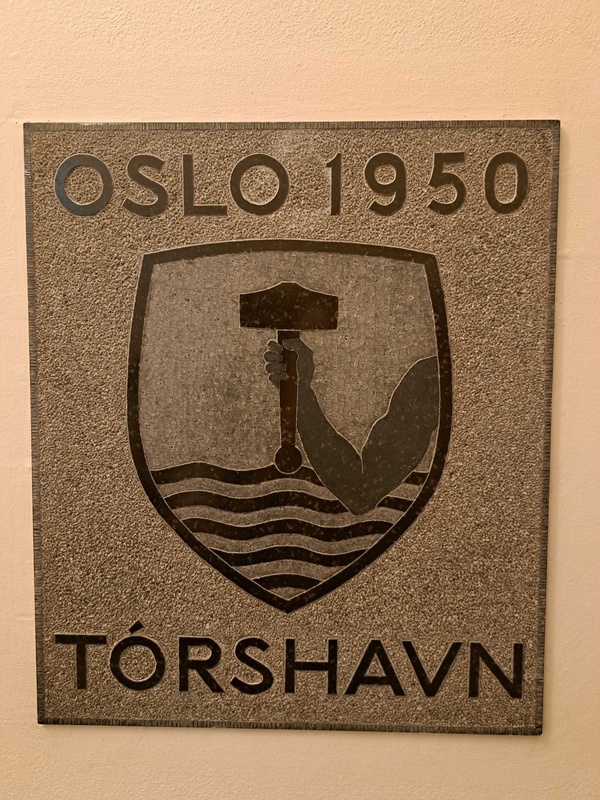 Tórshavn plaque featuring Thor's hammer coat of arms
