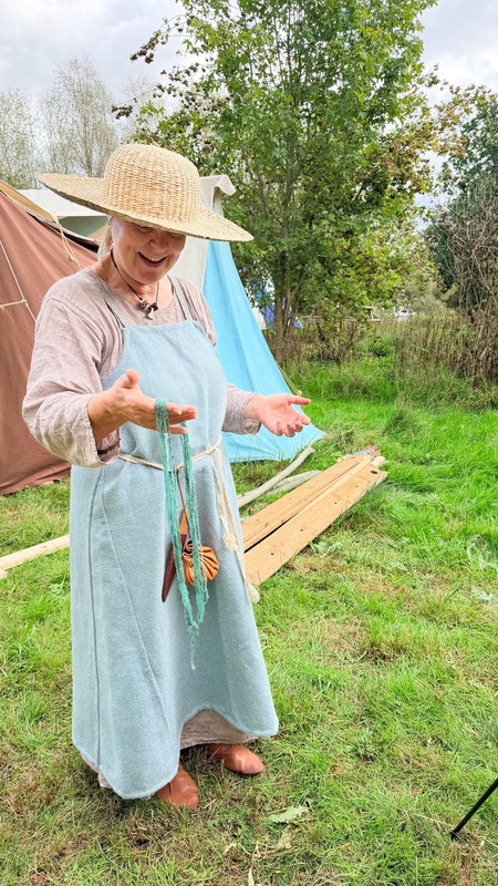 Re-enactor dyes woollen yarn at Conkers ( Leicestershire, UK)