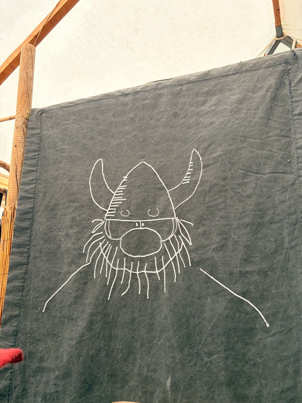 Hägar the Horrible depicted on a textured dark gray, fabric