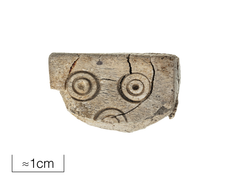 Bone dice with elder futhark runic inscription