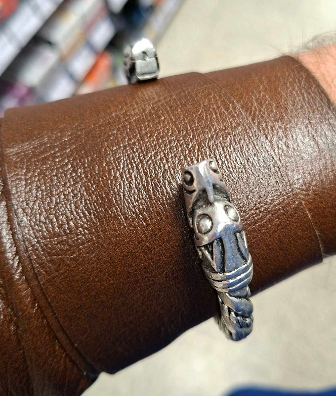 A replica Viking Age arm ring with beast heads