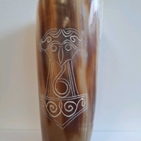 Drinking horn with mjolnir engraved on it