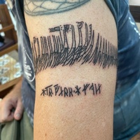 Tattoo based on a rune stick from Bryggen in Bergen depicting a fleet of ships
