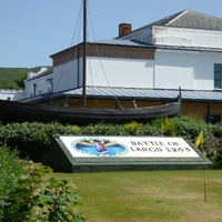 Replica Viking longboat and sign commemorating the Battle of Largs