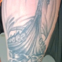 Tattoo of non-historical viking ship and a Valknut